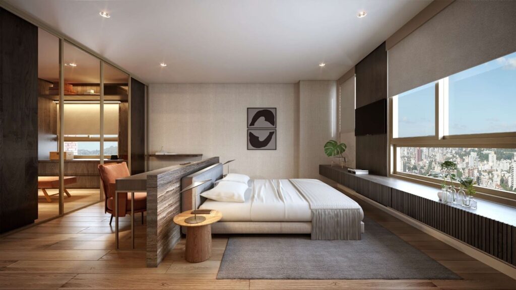 Suíte master configurada com espaço para closet, bancada e confortável área de descanso.